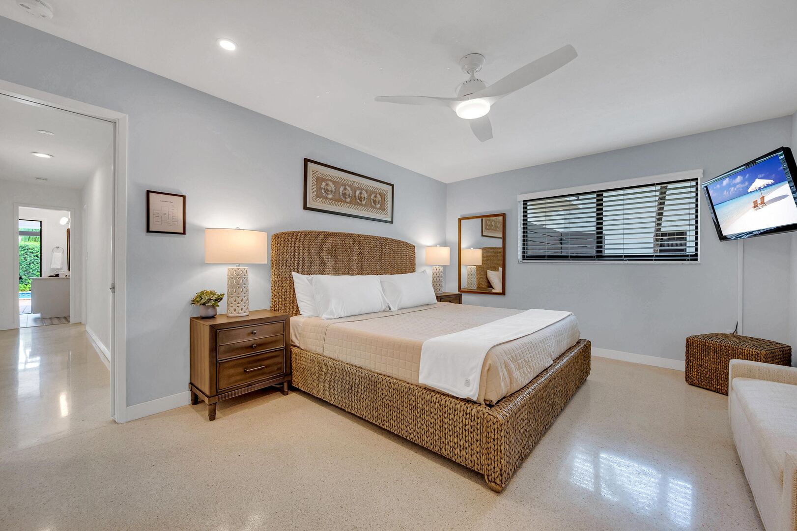 The spacious primary bedroom boasts a king size bed, en-suite bathroom and a smart TV.