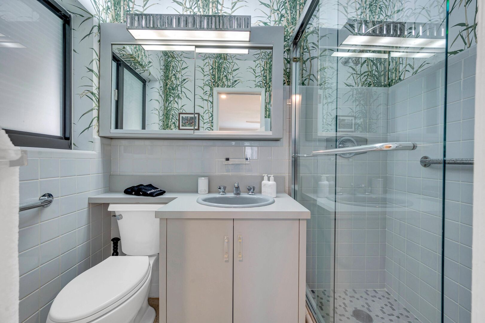 The primary en-suite full bathroom with a walk-in shower.