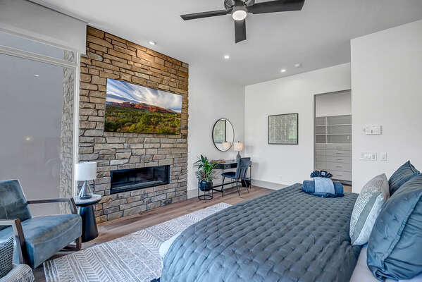 Floor to Ceiling Stone Fireplace and Desk Area