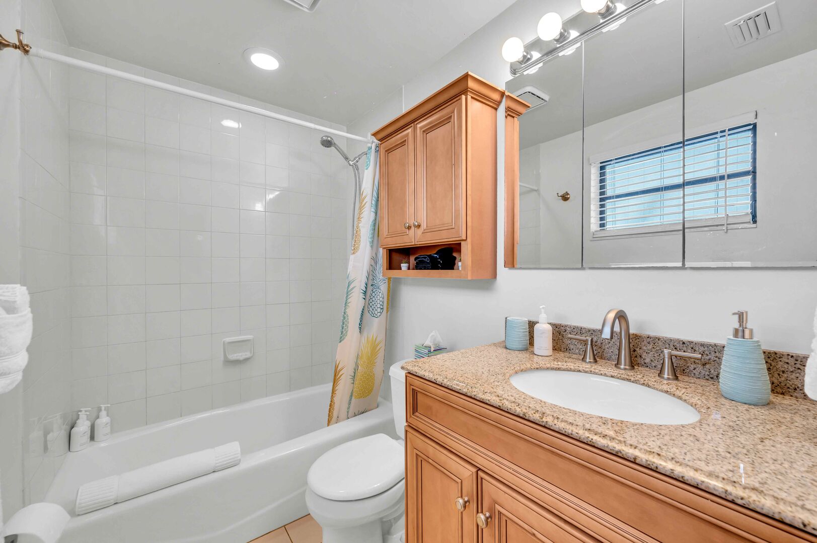 The bathroom has all the needed amenities, including tub/shower combo