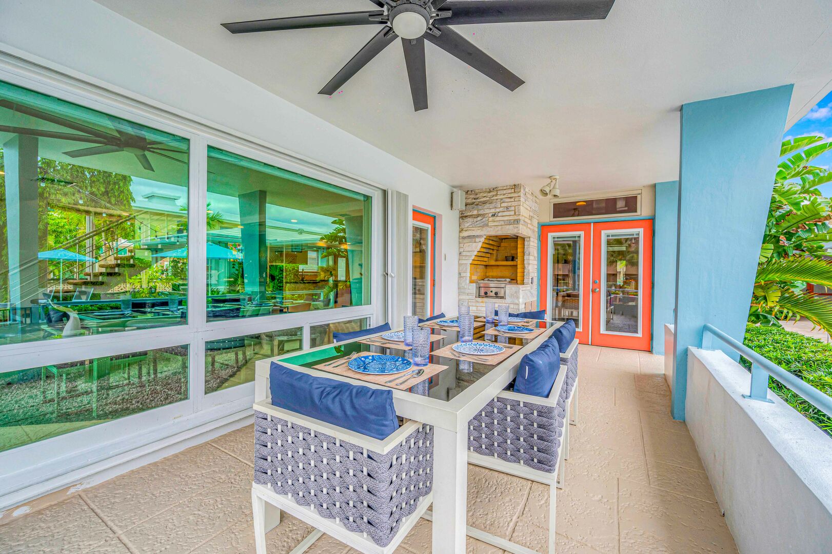Private dining patio fit for six with pool and canal views.