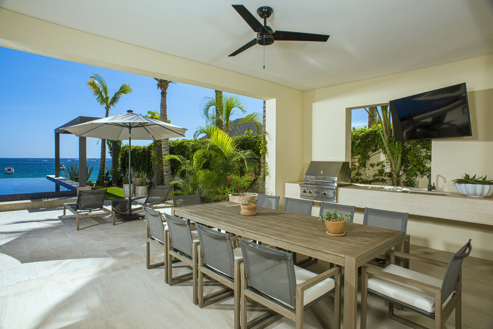 EXTERIOR DINNING ROOM WITH TV SOUND AND BBQ GRILL