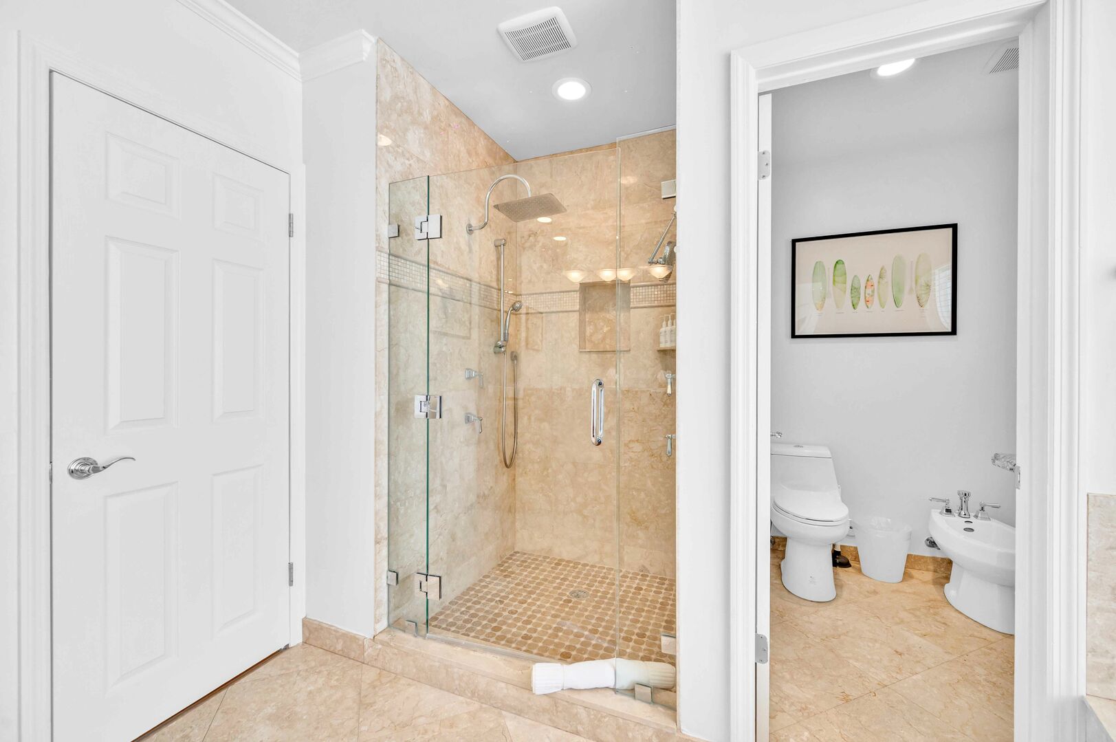The spacious shower in the Master bedroom has a rainfall shower head.