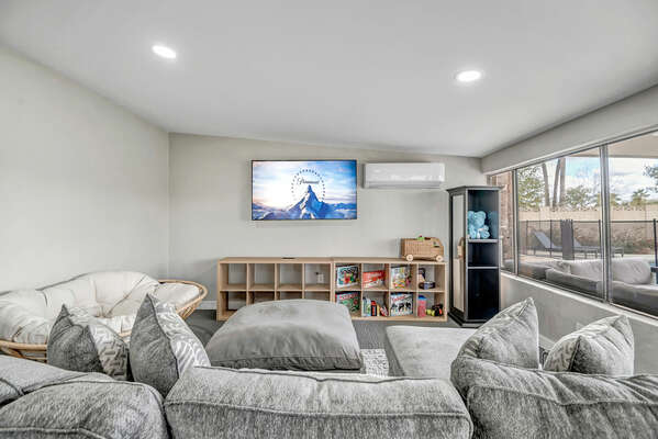 Game Room with Full Size Sleeper Sofa and Smart TV