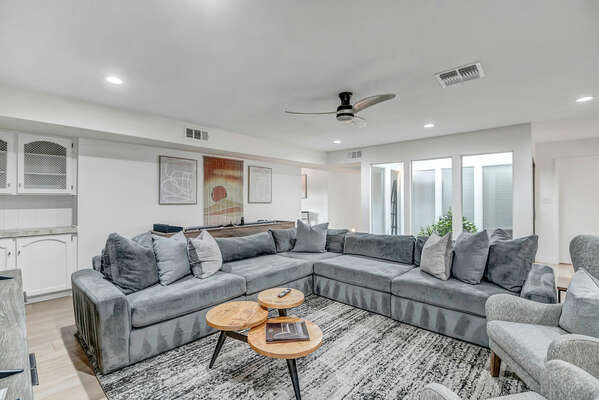 Living Room with Large Sectional Couch, Accent Chairs and Smart TV
