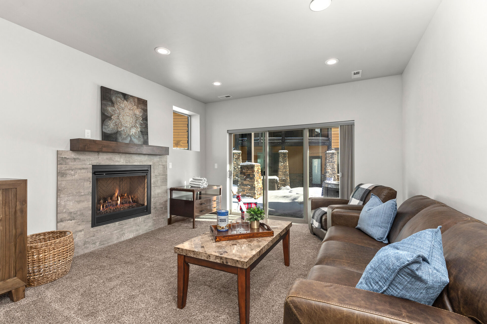 Lower Level Family Room with a Gas Fireplace and Access to the Hot Tub