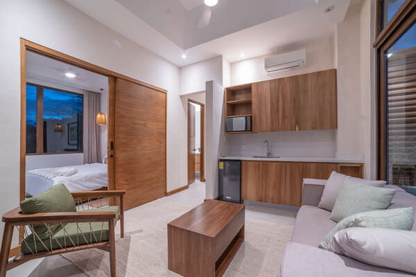 Master Bedroom 4 , living room area with Smart TV and private balcony.