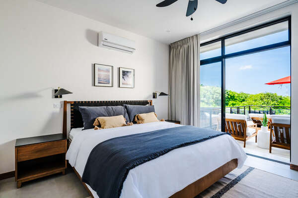 #1. Step into our inviting ground-floor bedroom, offering nature views and direct terrace access