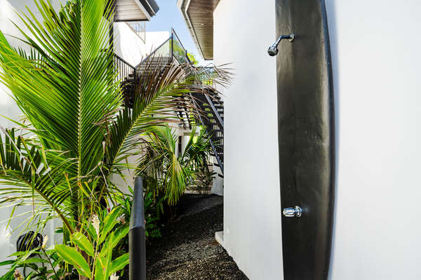 Embrace the coastal vibes at home with our surf-shaped outdoor shower