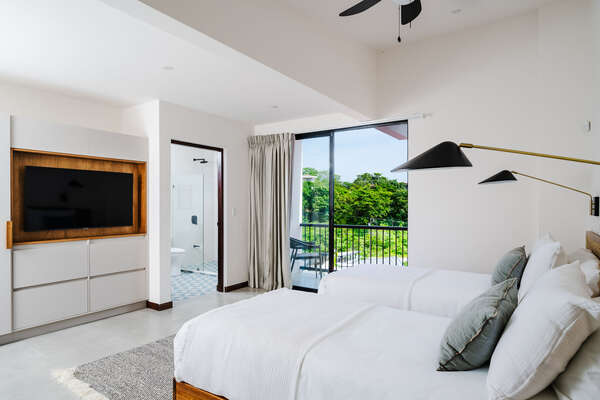 #6. Embrace nature's beauty from our upstairs bedroom, where you can enjoy lovely views and relax on the balcony