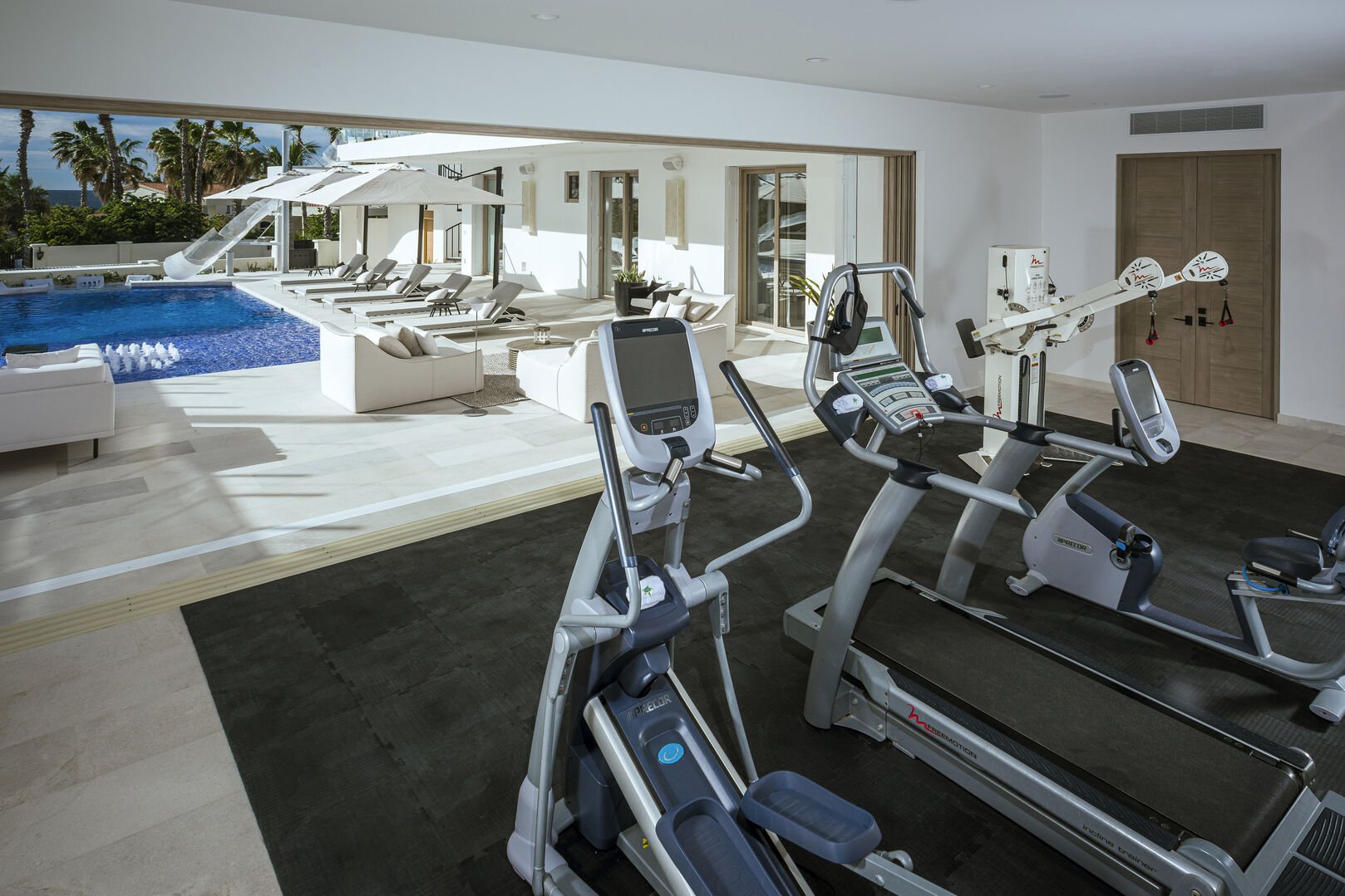 Fitness area with pool view