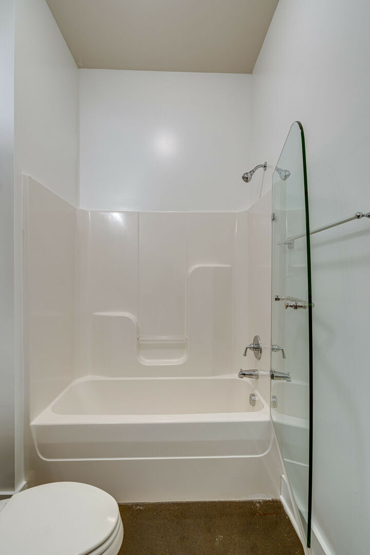 Full bathroom with shower and tub combo