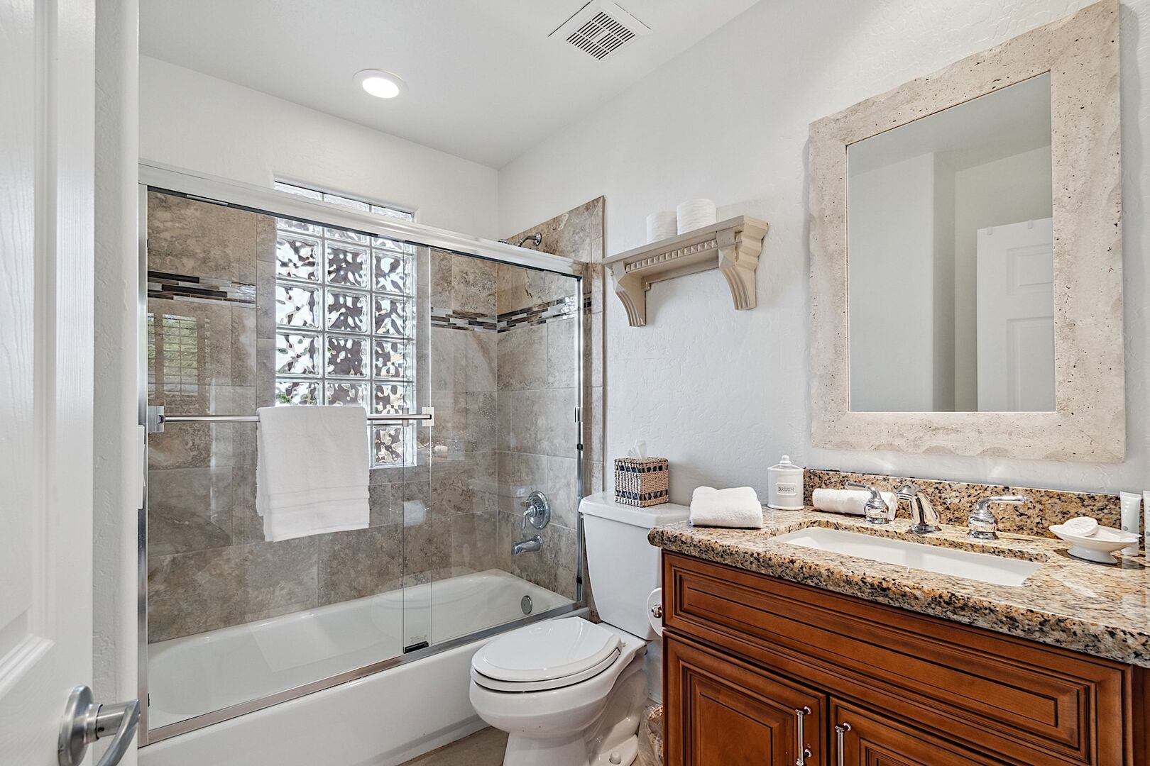 Casita bathroom has a rub / shower combo w/ single-sink vanity.