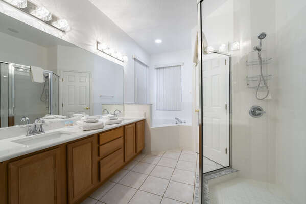 Master Suite showing dual sink vanities, garden tub and shower