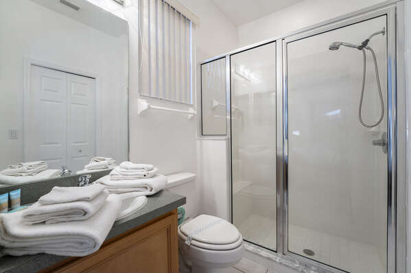 En-Suite bath with shower and single sink vanity