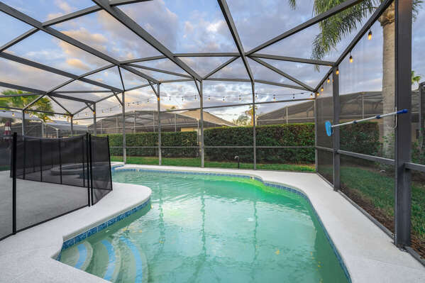 Semi-private pool area with screen enclosure and child safety fence