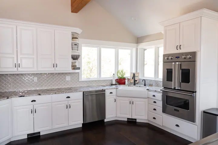 This massive kitchen is set up to host your own Iron Chef competition.  All of the appliances are professional grade.  Wolf Range and Double Ovens, Sub-Zero Refrigerator and just about every kitchen gadget you might need to win a cooking competition