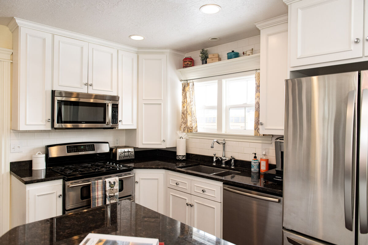 A bright and sunny kitchen with spacious island just perfect for cooking. Plenty of room to cook for a family or just to sit and chat.  The kitchen is stocked with just about every thing you could possibly need!
