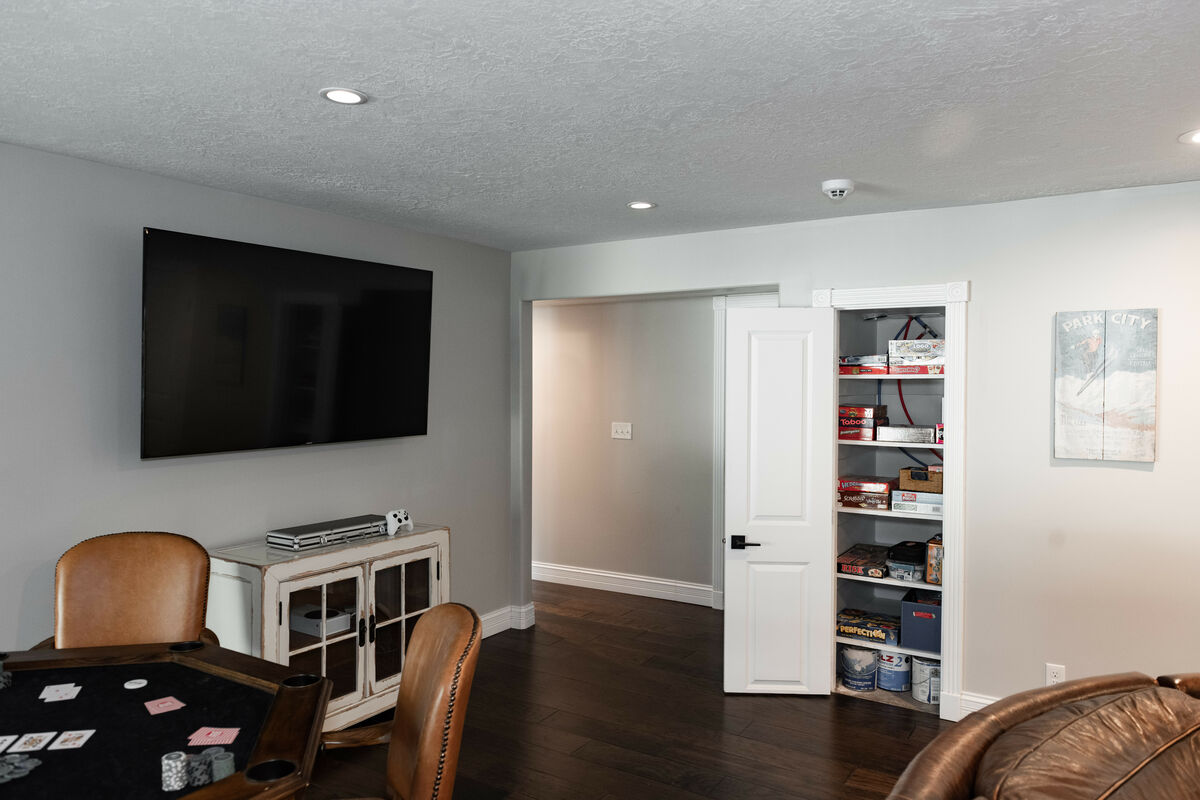 The downstairs family room has a huge overstuffed leather sectional, A massive Smart TV, a John Elway professional Poker table with a full set of 13.5g chips as well as an Xbox online console and a 2nd TV just for Gaming