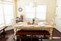 Just off the kitchen and surrounded by windows that look out over the front lawns the dining room table seats up to 10.  A hot chocolate station in the winter and lemonade station in the summer.
