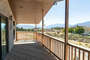 This balcony can be accessed through the sliding door between the Family and Dining Room. From here you have stunning views of the Valley.  In the distance is Mount Timpanogos with Deer Creek reservoir near its base.