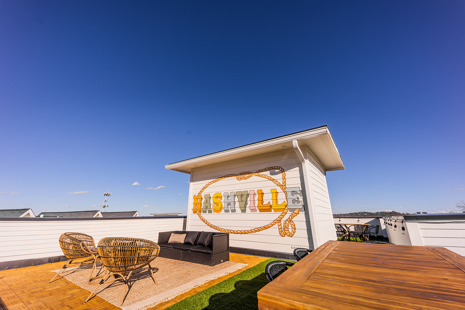 Rooftop Patio with Photo Mural and outdoor seating/dining. (4th Floor)