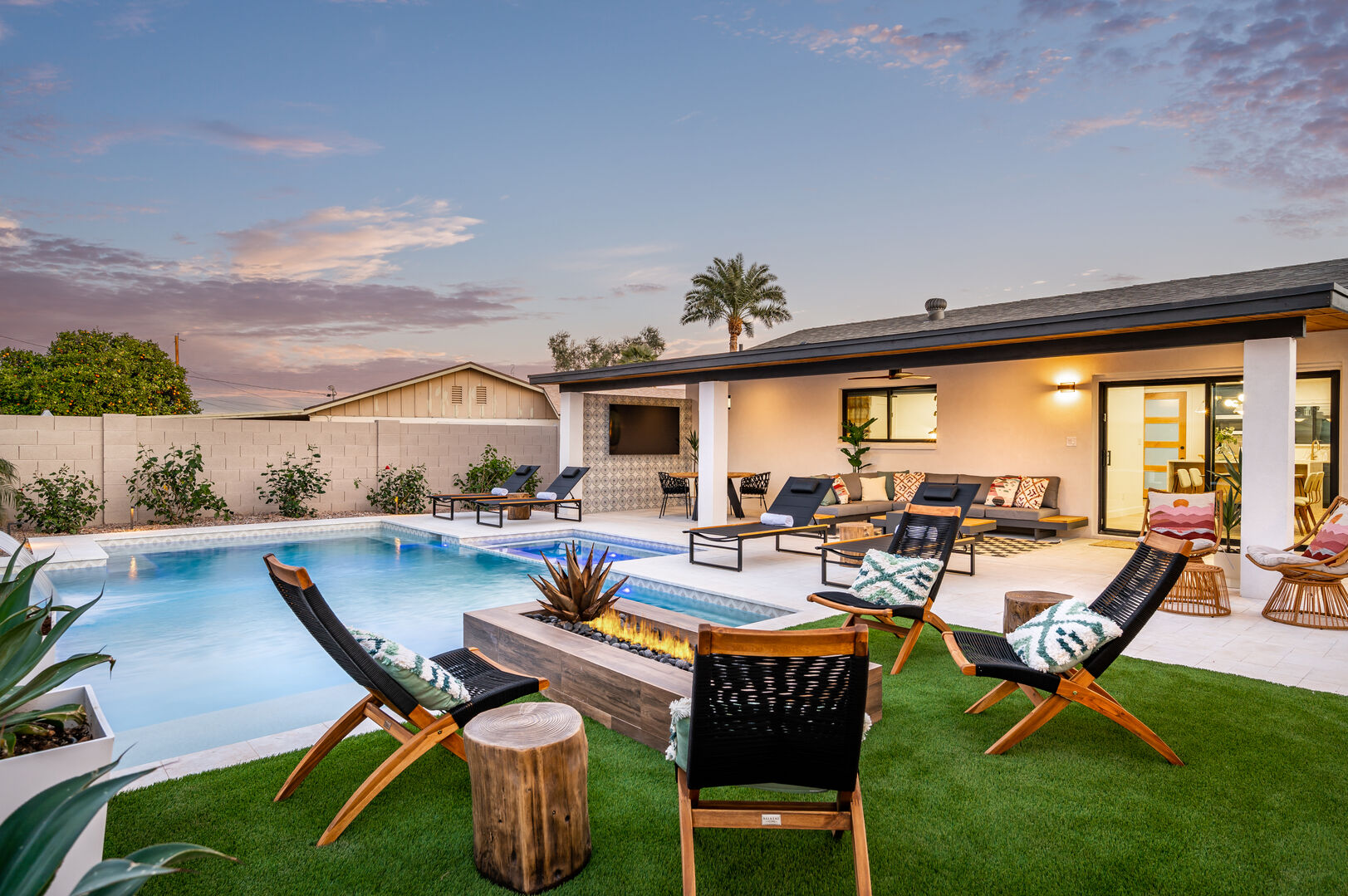 Gather around the fire pit or lounge by the pool.