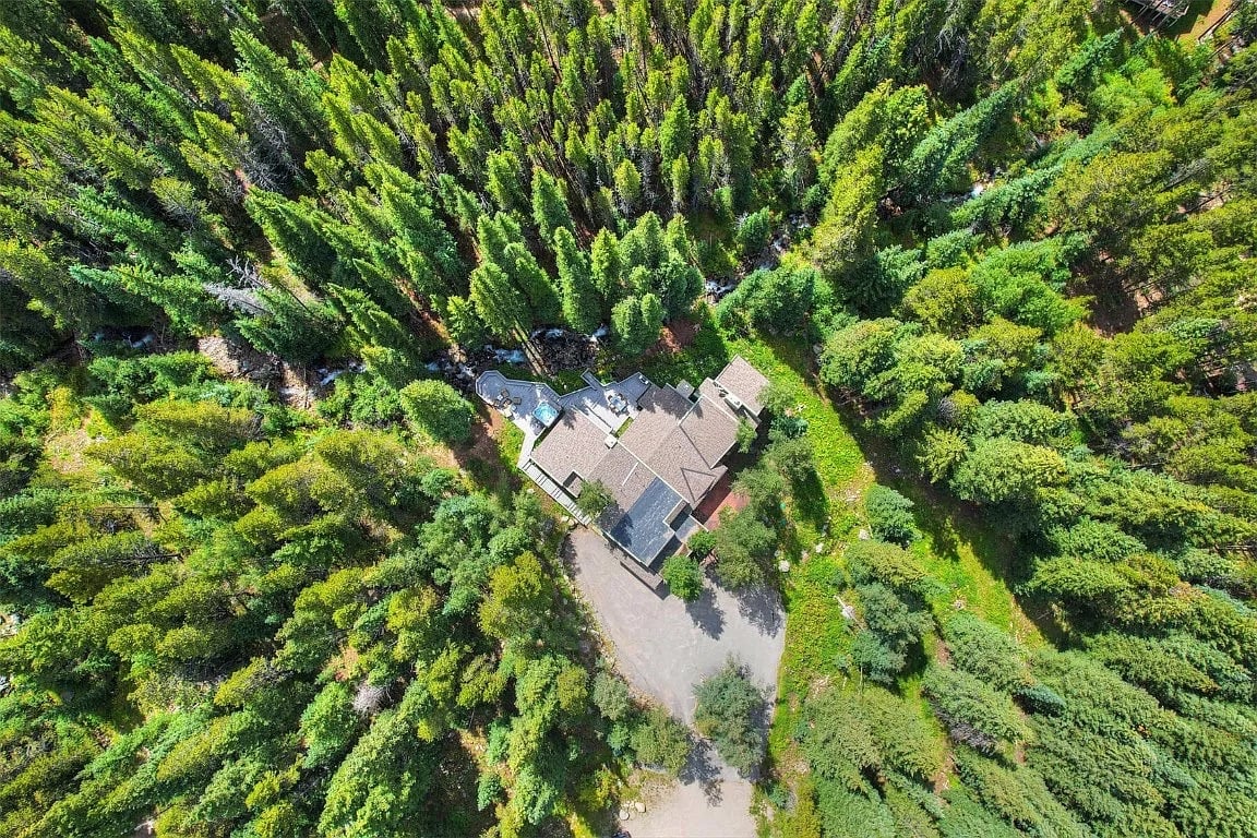 Towering 100' Lodge Pole Pines surround the home.  Creekside is located in a private cul du sac, and backs onto 100's of acres of national forest.  World class hiking begins just steps from the back door, across your private bridge to paradise.