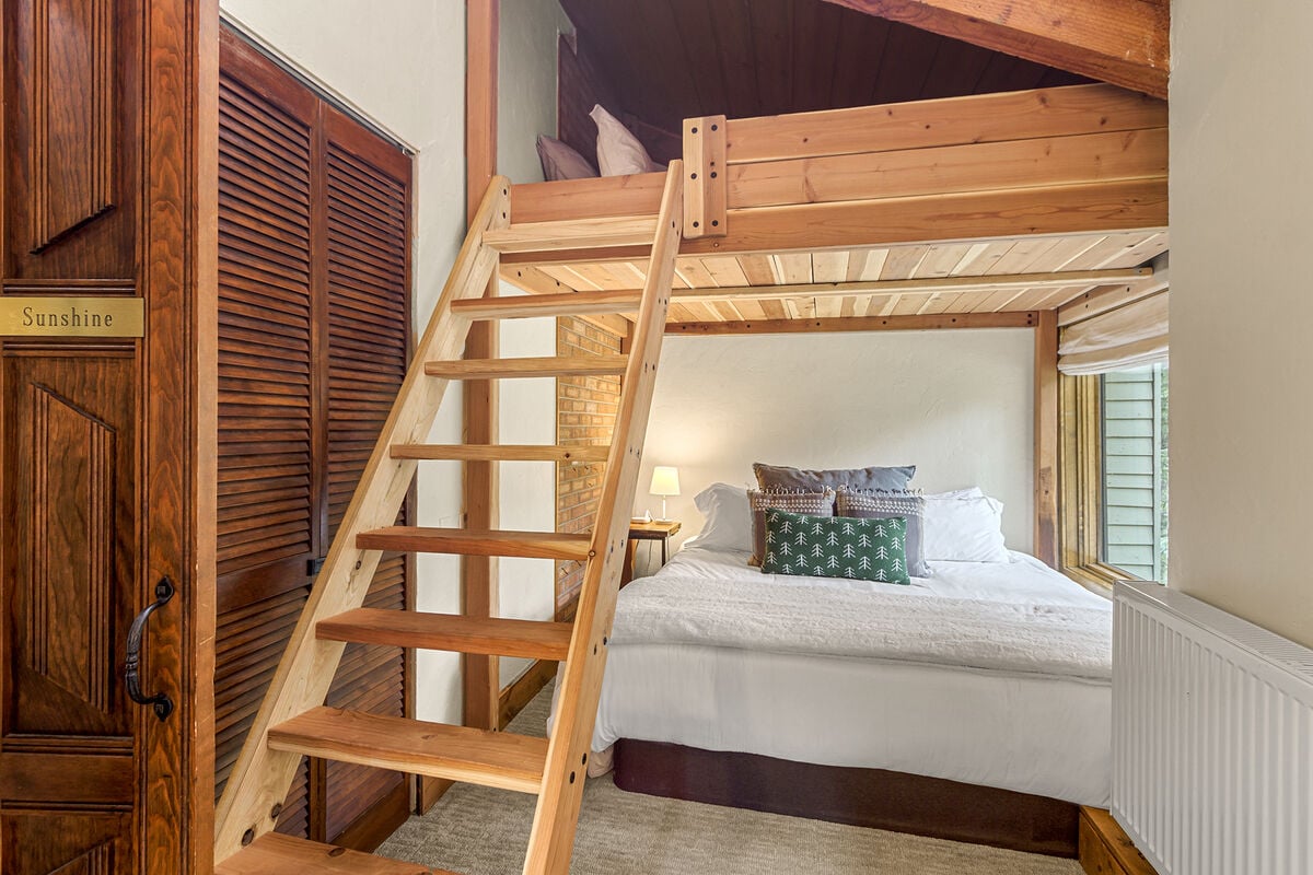 The 2nd upstairs bedroom features a King platform bed and Queen custom loft overhead. Perfect for families.