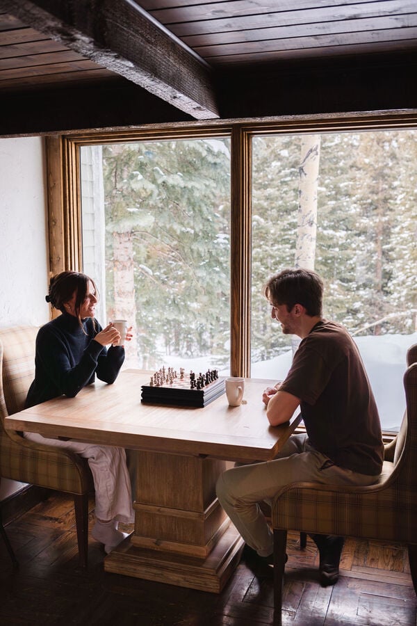 Strategic Game of Chess: Engage in a thoughtful game of chess, situated in a spot where you can admire the breathtaking forest views.