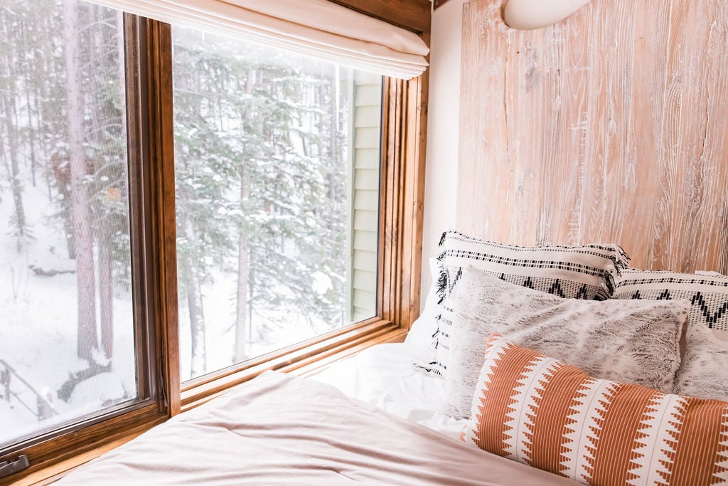 The master bedroom overlooks the gentle creek, offering the best morning views imaginable. It's where the day begins with the soothing sounds of flowing water.