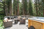 Large hot tub and seating area provide plenty of space to relax outside in nature with friends and family