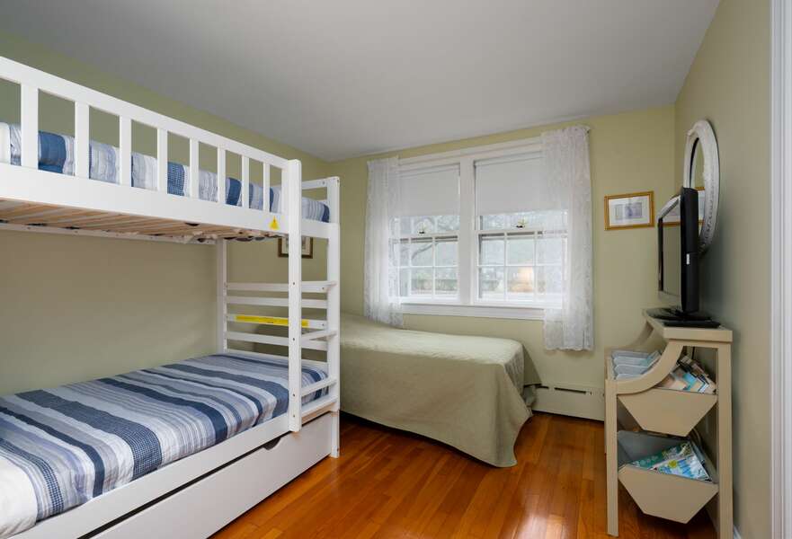 Bunk room with four total Twins and a flat screen TV - 177 Old Stage Road Centerville Cape Cod - Family Tides - New England Vacation Rentals