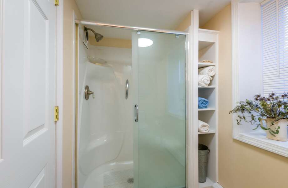 Full Bath #2 with shower stall and glass doors.