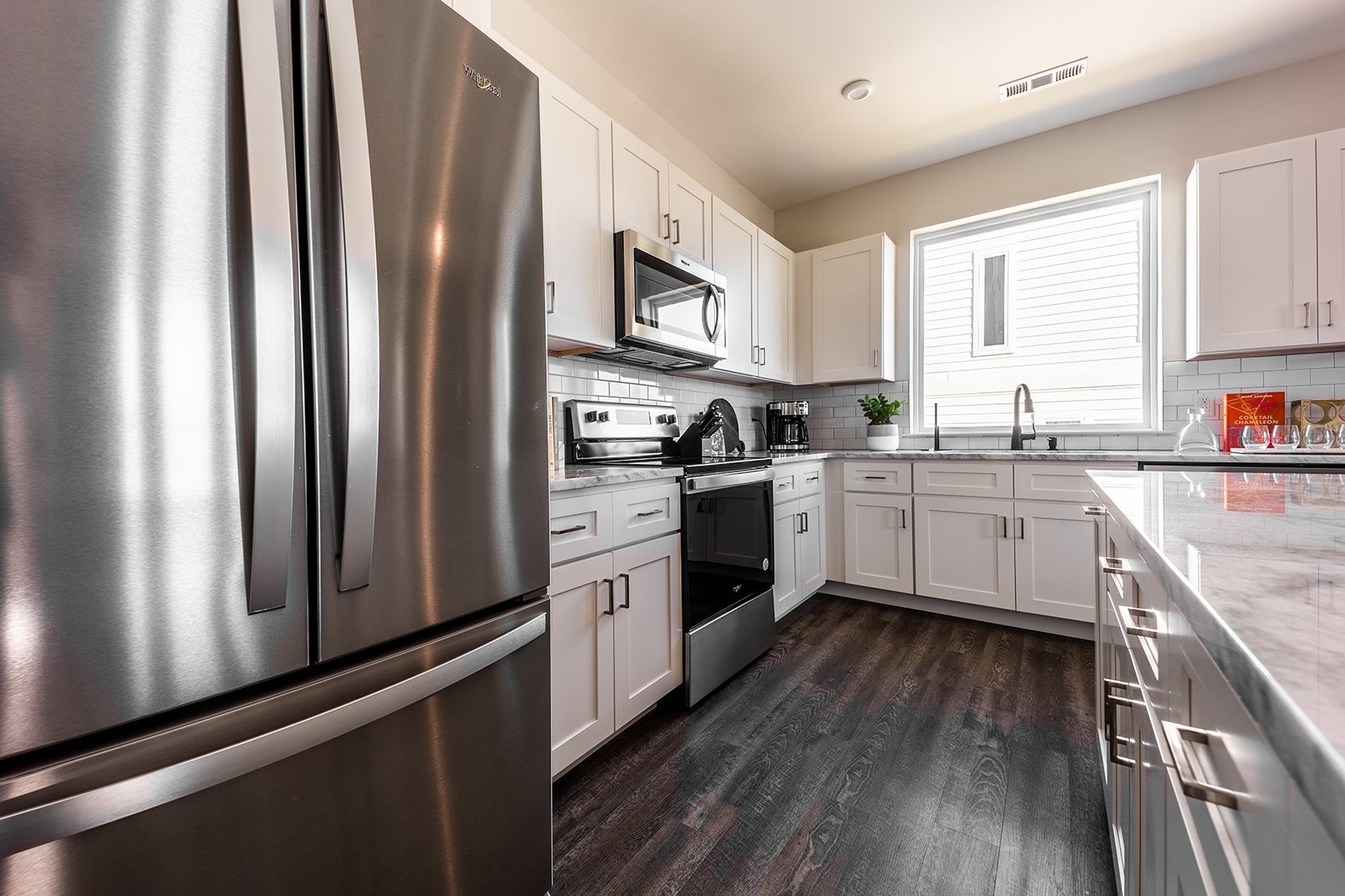 Fully equipped kitchen stocked with your basic cooking essentials. Complete with stainless steel appliances and breakfast bar seating.