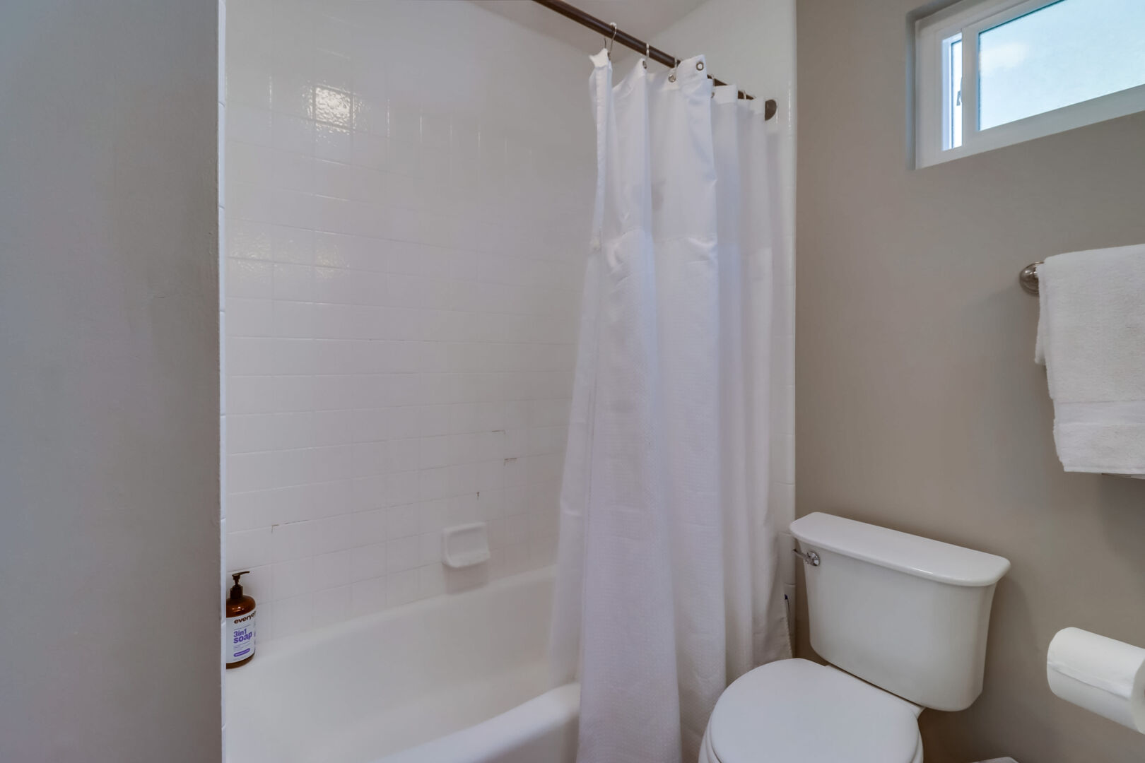 Guest bathroom on second level with shower-tub combo