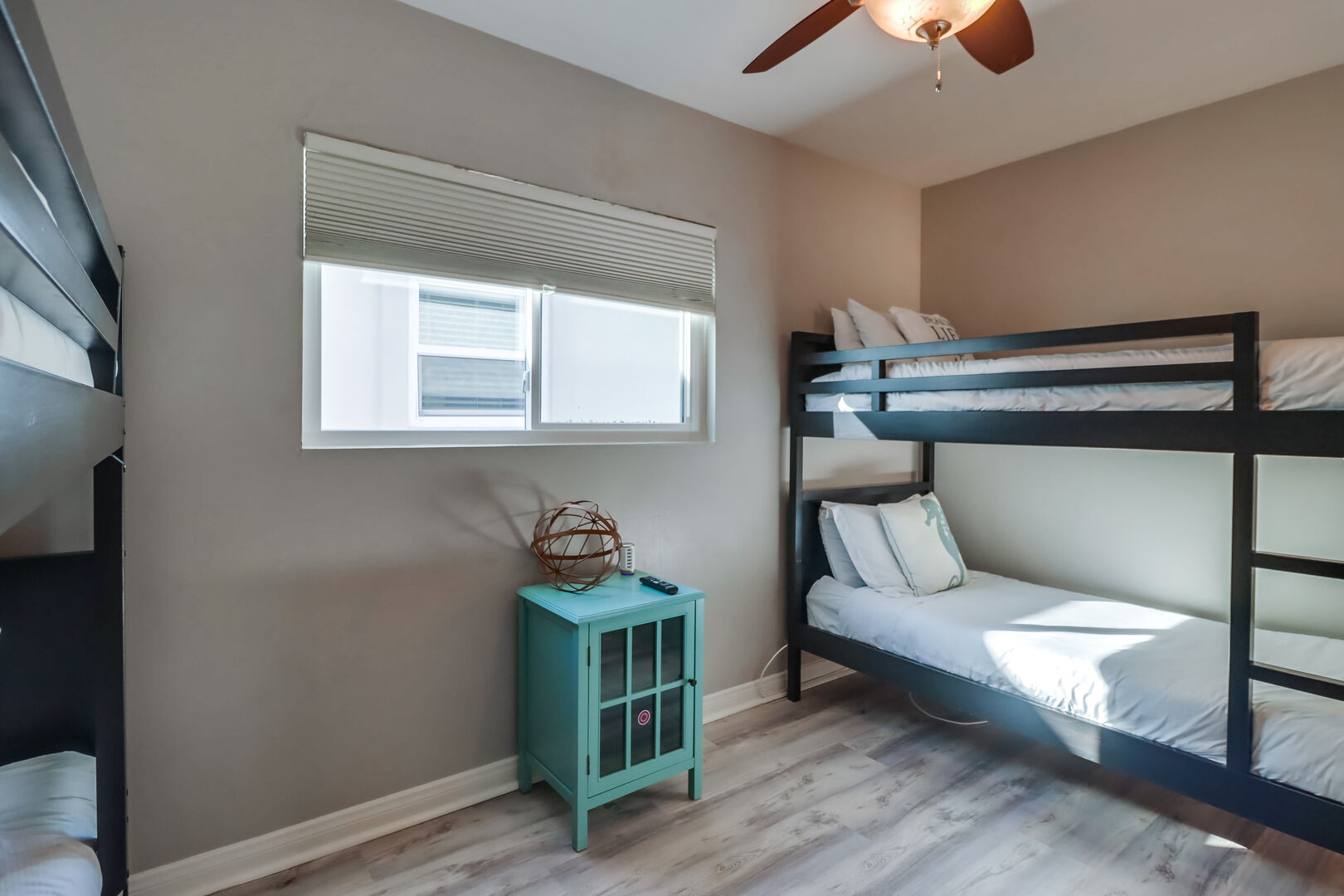 Second level guest bedroom great for kids with ample floor space, closet storage and ceiling fan