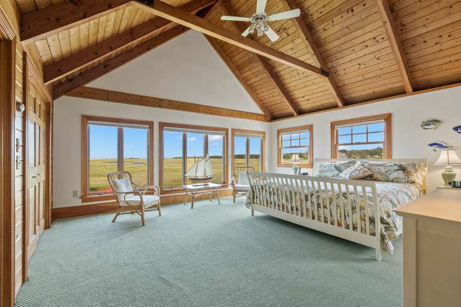 Primary bedroom with lots of space, cathedral ceilings and amazing views from every angle - 7 Sunrise Lane Sandwich