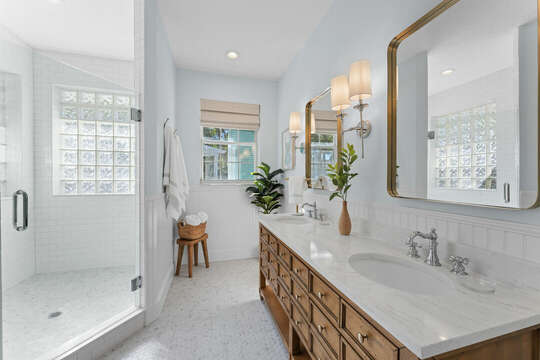 Master ensuite bathroom with a double sink, toilet and walk in shower.