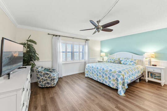Spacious master bedroom with King Bed & TV