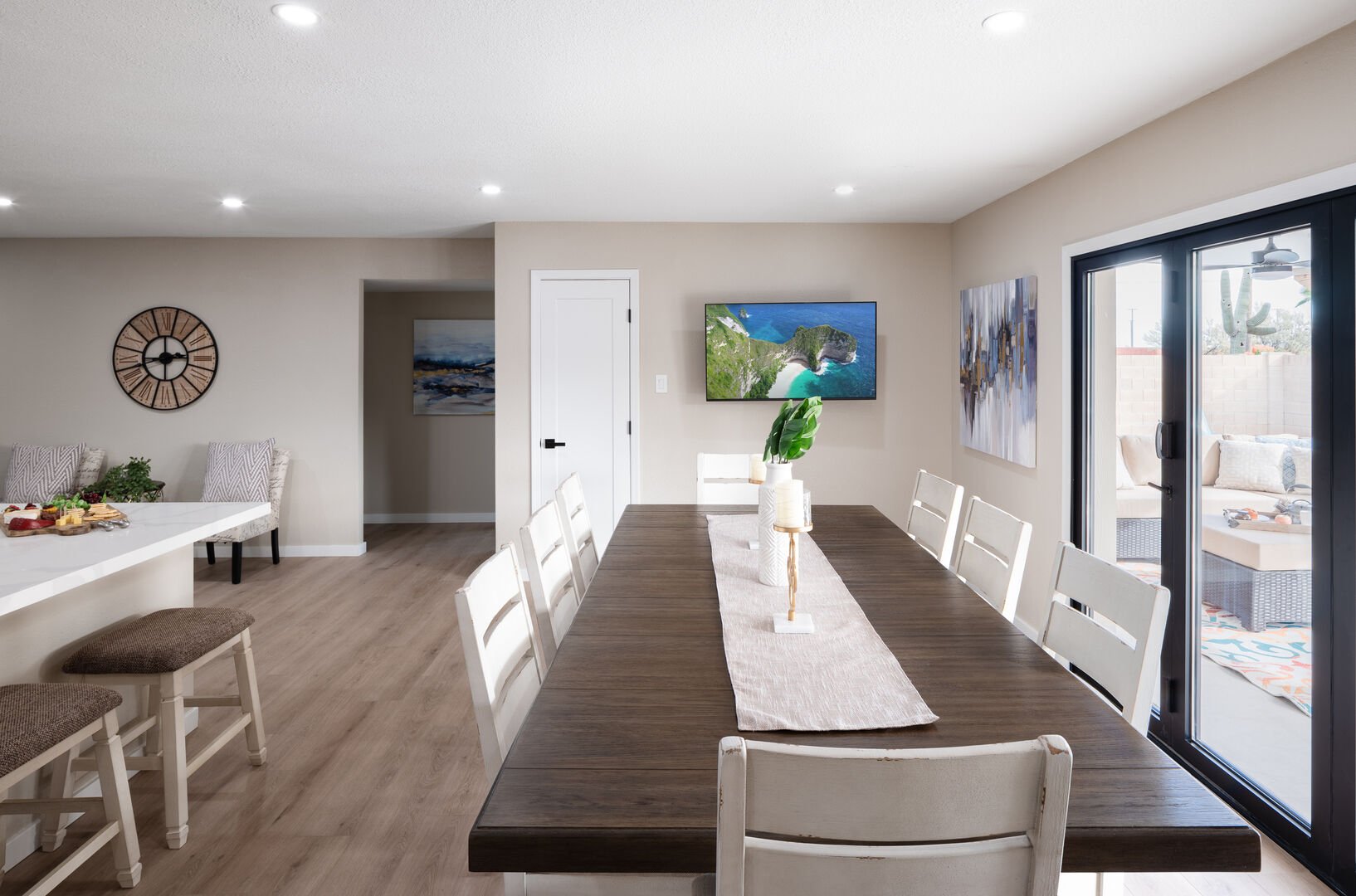 Dining area in kitchen with large accordion opening doors, Smart TV, and direct access to kitchen.