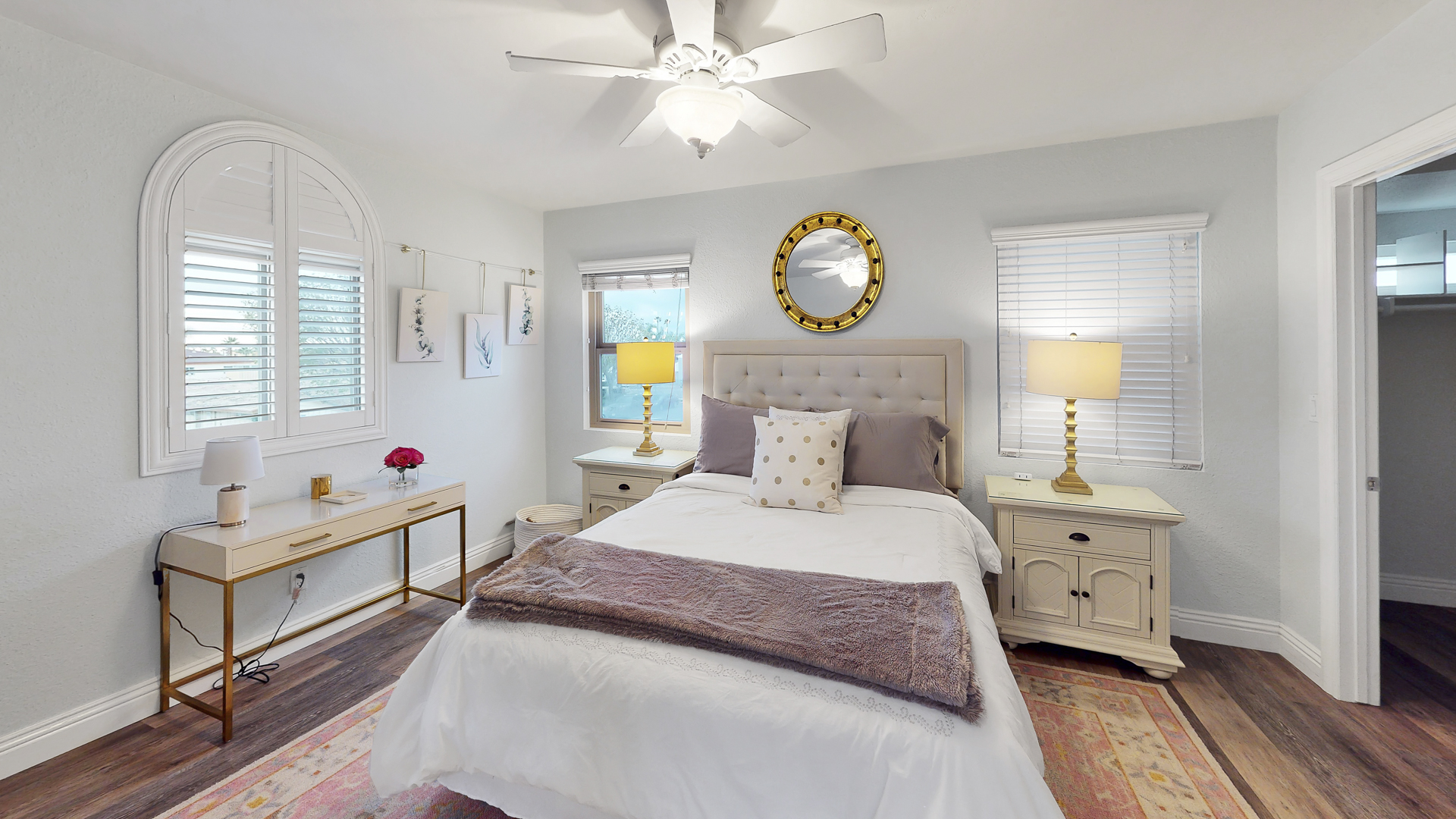 Second master suite has a ceiling fan and even a corner view of the beach on a clear day!