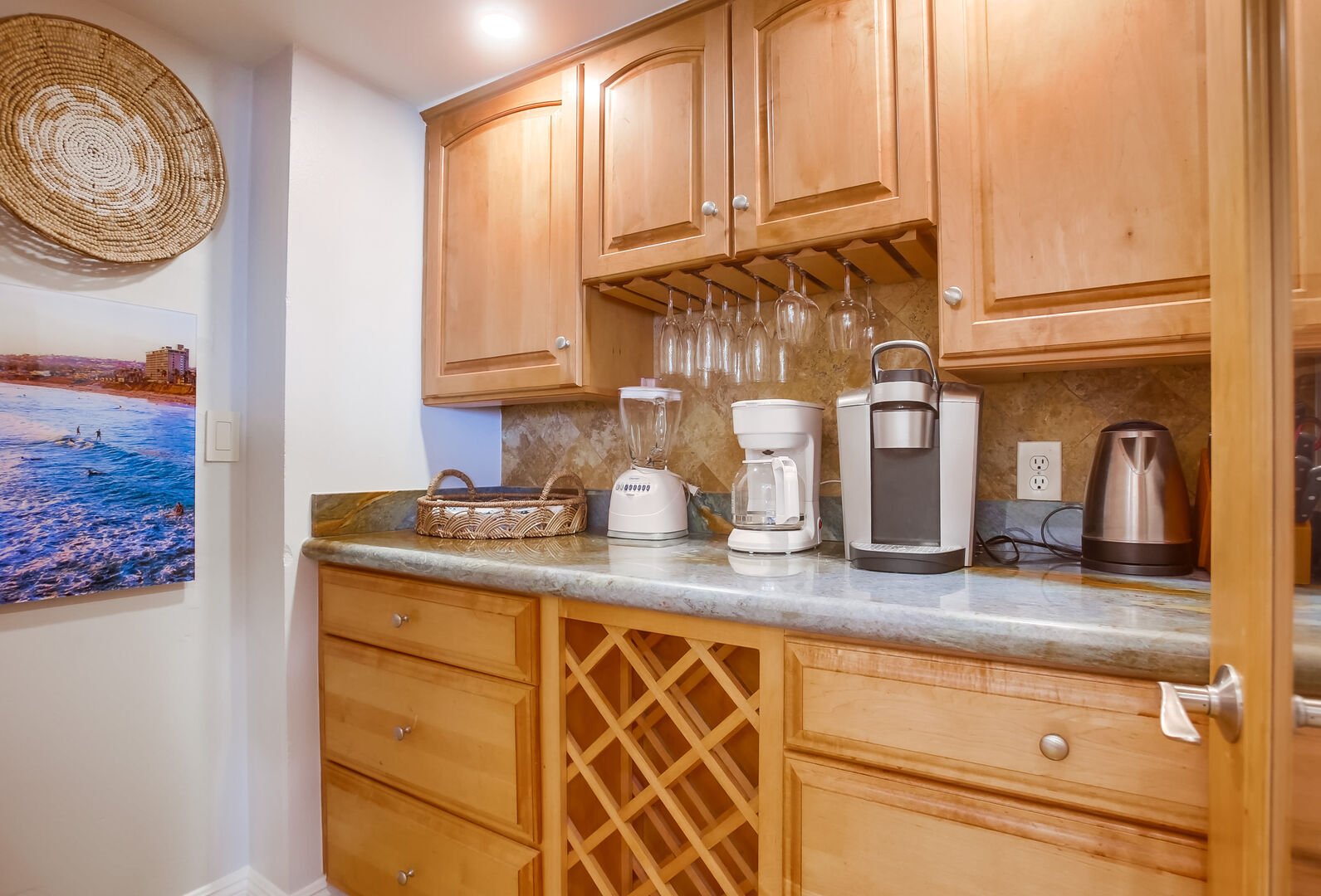 Pantry with storage space and wine rack. Additional kitchen small appliances like a standard and Keurig coffee maker, tea pot, blender and more!