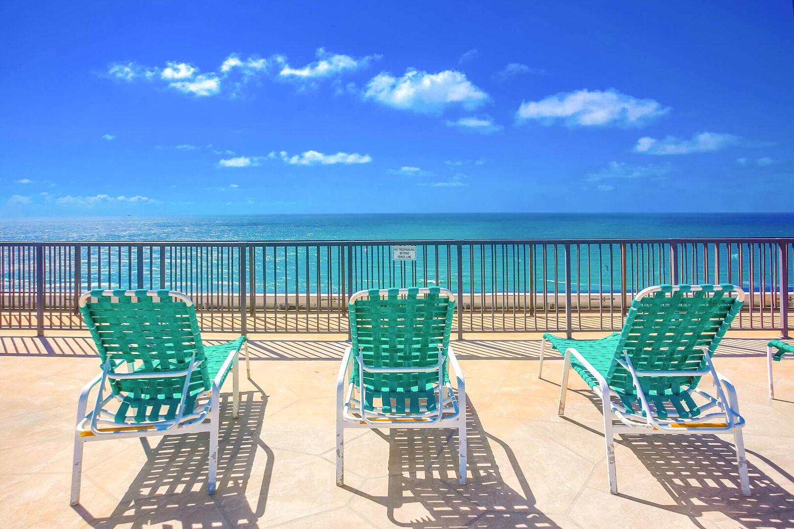 Capri by the Sea rooftop has communal lounge chairs, picnic tables and 360 ocean views!