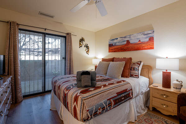 Master Bedroom with Queen Bed and Access to Patio