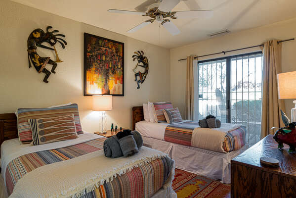 Bedroom Two with Two Twin Beds (Can be converted to King with a fee)  and Access to Patio