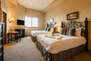 Main Level Master Bedroom 2 with Two Queen Beds, Smart TV and Gas Fireplace
