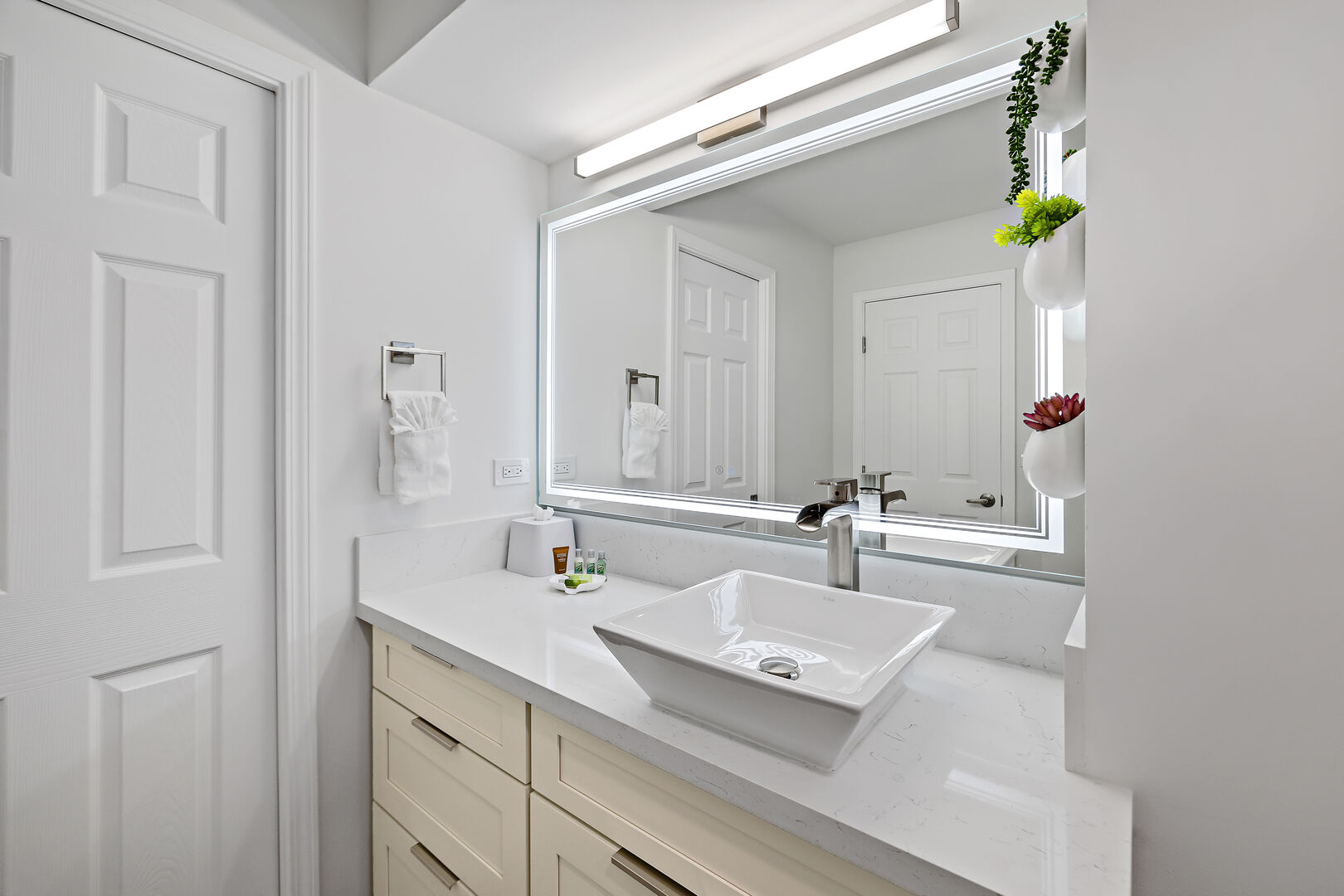Full bathroom with vanity and cabinet