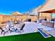 Fire pit are with four chairs, corn hole game, outdoor dining table, sitting area and BBQ grill.
