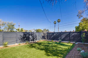 Beautiful fresh grass, fruit trees and solar lighting. Great for games with the kids and your pup!